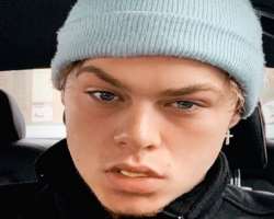 Ryan has piercing in both of his ears.